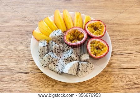 Passion Fruit, Dragon Fruit, Sliced Apples And Beautifully Arranged In A Ready-to-eat Rice Dish On A