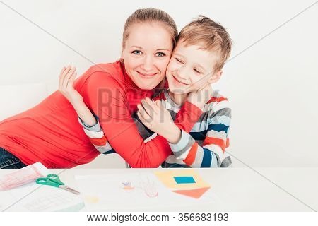 Son Holding And Kising His Mom On White Background