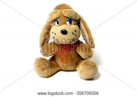 Toy Puppy Isolated On A White Background. Close-up. Soft Toy.