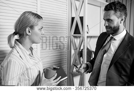 Love Affair At Work. Business Couple. Handsome Man Speak To Cute Woman In Office. Office Life. Boss 