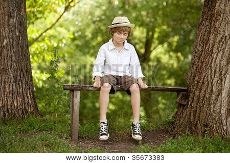 Fair-haired Boy In A Hat, Shirt, Shorts