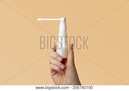 Treatment And Prevention Of Viral Respiratory Diseases. Woman Hands Holding Antiseptic Spray For Thr