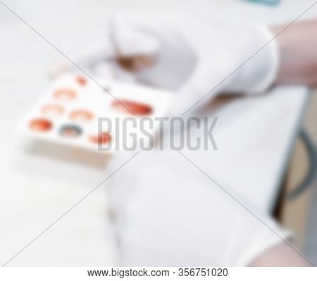 Scientist Working In His Laboratory. A Blood Test Is A Laboratory Analysis Performed On A Blood Samp