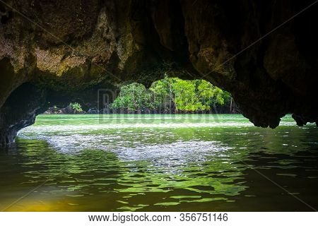 Caves In Limestone Cliffs, Phang Nga Bay, Thailand