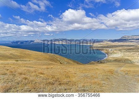 View Of Kapsel Bay And Kapel фкуф From The Slope Of Cape Meganom. Crimea, A Sunny Day In September.