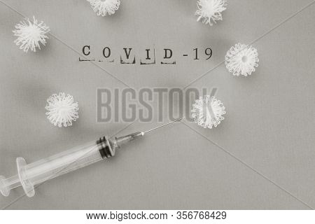 Syringe Vaccine Of Virus Convid 19 In Background