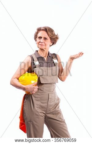 Happy senior woman holding a safety hat (isolated on white)
