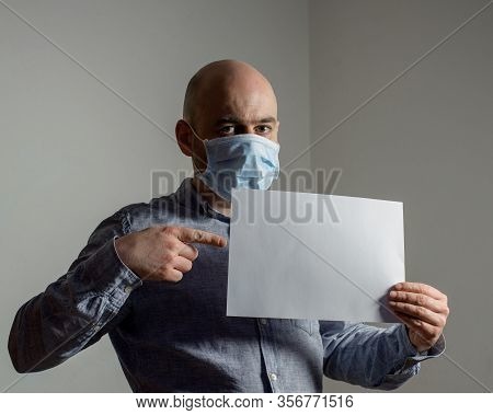 Man In Protective Face Mask With White Blank Sheet Poster Mockup