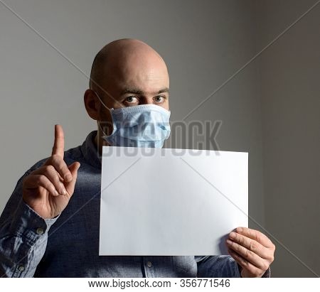 Man In Protective Face Mask With White Blank Sheet Poster Mockup