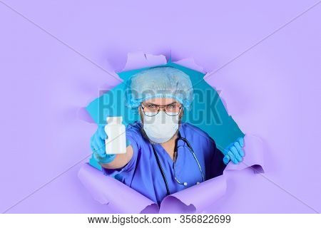 Through Paper. Doctor With Pills. Medicine. Nurse. Package Of Pills. Treatment Pill. Pharmaceutical 