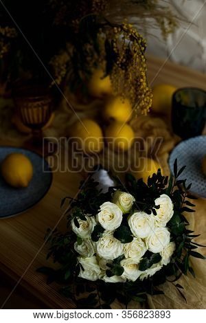 Wedding Bouquet Of White Roses On The Table