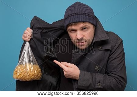 Smuggler Selling Food. Dealer In Hat And Coat Offering To Buy Pasta. Deficit Of Food Because Of Pani