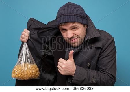 Smuggler Selling Food. Dealer In Hat And Coat Offering To Buy Pasta. Deficit Of Food Because Of Pani