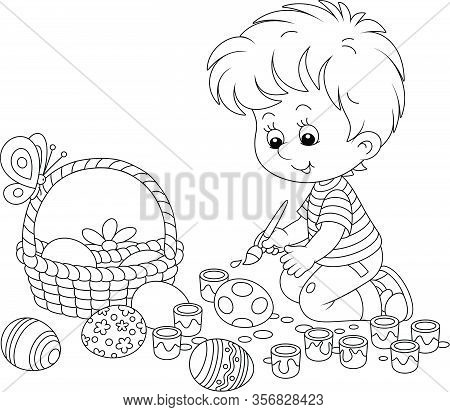 Happy Little Boy Getting Ready For The Holiday, Coloring And Decorating Easter Eggs With A Paintbrus