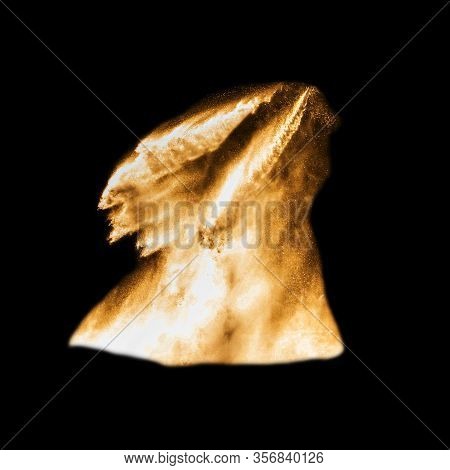Splashes Of Golden Water Isolated On A Black Background.
