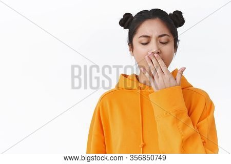 Tired Cute Female Asian Student Study All Night, Didnt Have Much Sleep, Close Eyes And Yawning Lazy,