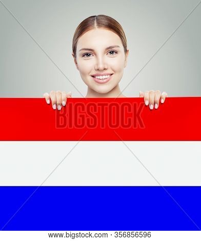 Love Netherlands! Happy Woman Smiling And Showing On Netherlandish Flag Background