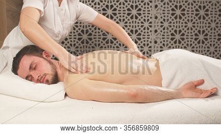 Man Receives A Therapeutic Full-body Massage At The Sap Center.