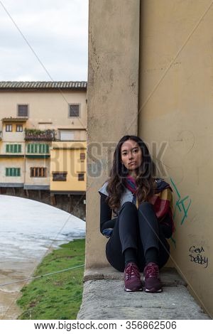 Florence, Italy - 12, March, 2018: Vertical  Picture Of Beautiful Model Posing Close To Ponte Vecchi