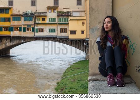 Florence, Italy - 12, March, 2018: Horizontal Picture Of Brunette Model Posing Close To Ponte Vecchi