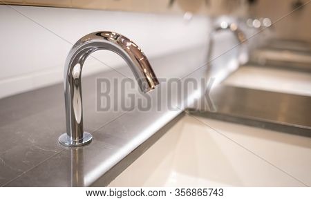 Chromed Metal Automatic Fauget To Mix Cold And Warm Water On A Marble Sink Toilet In Department Stor