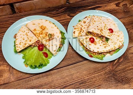 Fajitos With Minced Meat Vegetables In A Corn Tortilla On A Blue Plate Dark Wooden Background. Fast