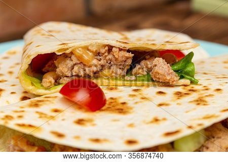 Fajitos With Minced Meat Vegetables In A Corn Tortilla On A Blue Plate Dark Wooden Background. Fast 
