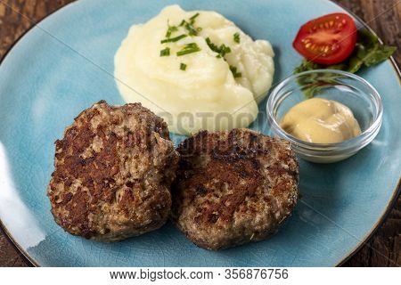 Two Bavarian Meat Loafs On A Plate