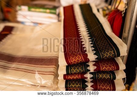 Folded Silk Dhoti With Green And Red Border Design