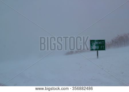 Cold And Foggy Winter Day: Snow Storm In The Mountains On 9600 Ft