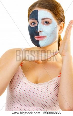 Girl With Black White Mud Mask On Face