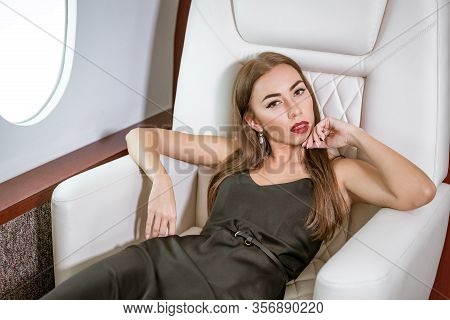 Beautiful Rich Woman In A Private First Class Plane.