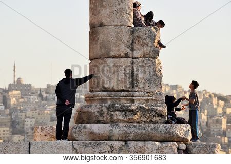 Amman, Jordan - February 15, 2020. Unidentified People At Sunset In Amman Citadel, Jordan. The Amman