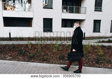 Young Handsome Man Walking In A Residential Area During Covid-19 Coronavirus Global Epidemic, In Qua