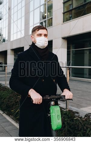 Caucasian Young Man Near His Office Wearing Surgical Face Mask To Protect From Coronavirus Covid-19