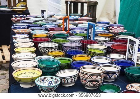 A Lot Of Colorful Pots On A Stall At Fleamarket At Mauerpark In Berlin
