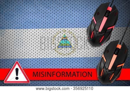 Nicaragua Flag And Two Computer Mouses. Misinformation During Coronavirus Or 2019-ncov Virus Concept