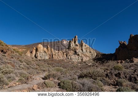 View Of Roques De García Unique Rock Formation With Famous Pico Del Teide Mountain Volcano Summit In