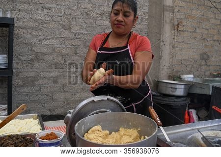 Old Woman Preparing A Typical Mexican Food