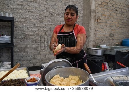 Old Woman Preparing A Typical Mexican Food