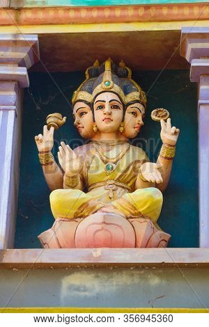 Ancient Sculpture Of The Hindu God Shiva Close-up. Detail Of The Design Of The Hindu Temple Of The S