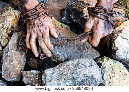 Hands Of A Humble Slave Who Is Not Trying To Free Himself Against A Dark Background, The Concept Of 