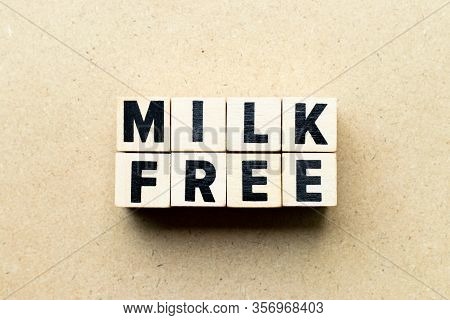 Letter Block In Word Milk Free On Wood Background