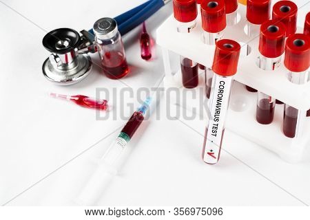 Positive Coronavirus Blood Test Concept. Analyzing Blood Sample In Test Tube For Coronavirus Test. T