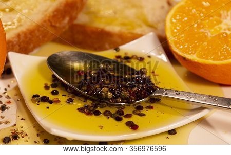 Bread Olive Oil Pepper And Oranges In Spoon