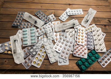Closeup Shot Of Different Pills On Table With Tablets , Pharmaceutical Industry Concept