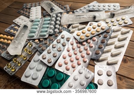 Closeup Shot Of Different Pills On Table With Tablets , Pharmaceutical Industry Concept
