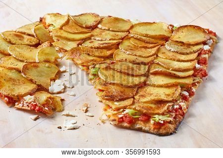 Tart Flambe Or Flammkuchen On Wooden Cutting Board, Traditional Alsatian Pie, Rustic Style.