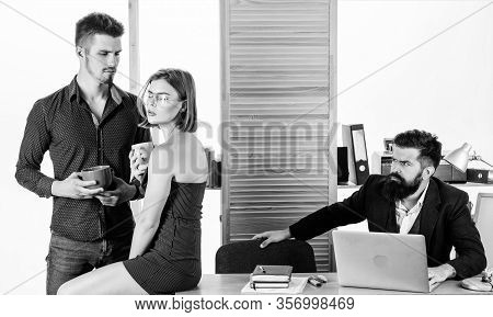 Taking A Lunch Break. Business Partners Enjoying Conversation In Lunch Break While Colleague Working