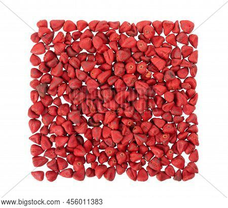 Annatto Seeds, Isolated On A White Background. Achiote Seeds, Bixa Orellana. Natural Dye For Cooking